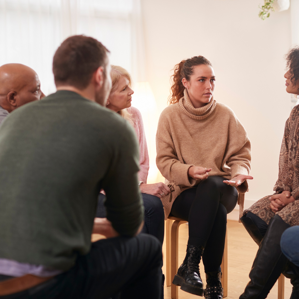 A group of people sitting in a circle
